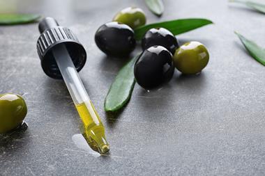 A picture of olive oil in a pipette