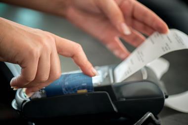 Someone using a card payment machine